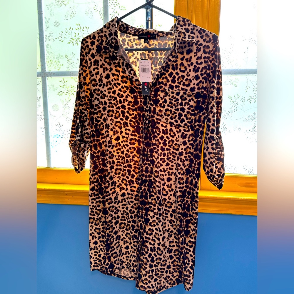 Woman’s large, leopard print blouse